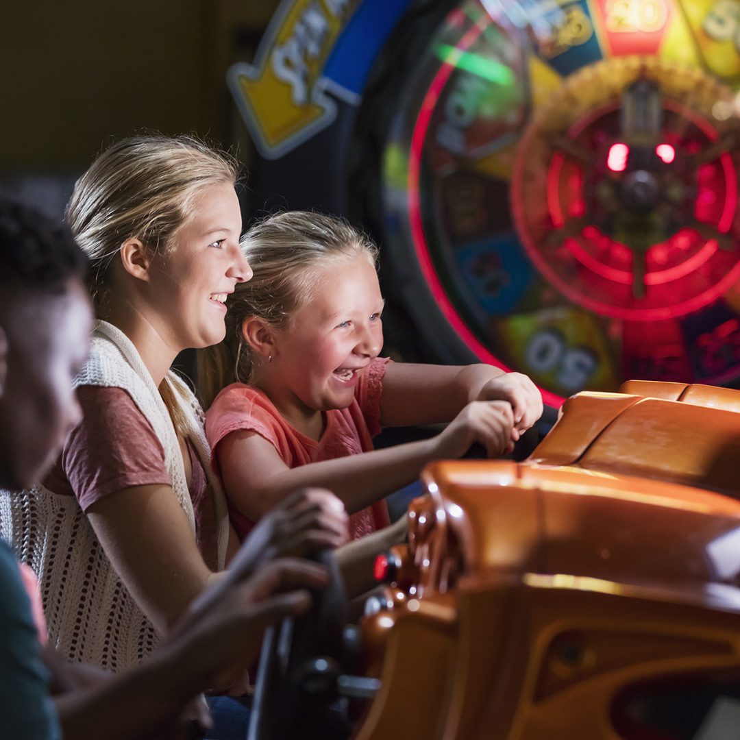 Children playing arcade games at Mira Amusement in the Montreal Forum.